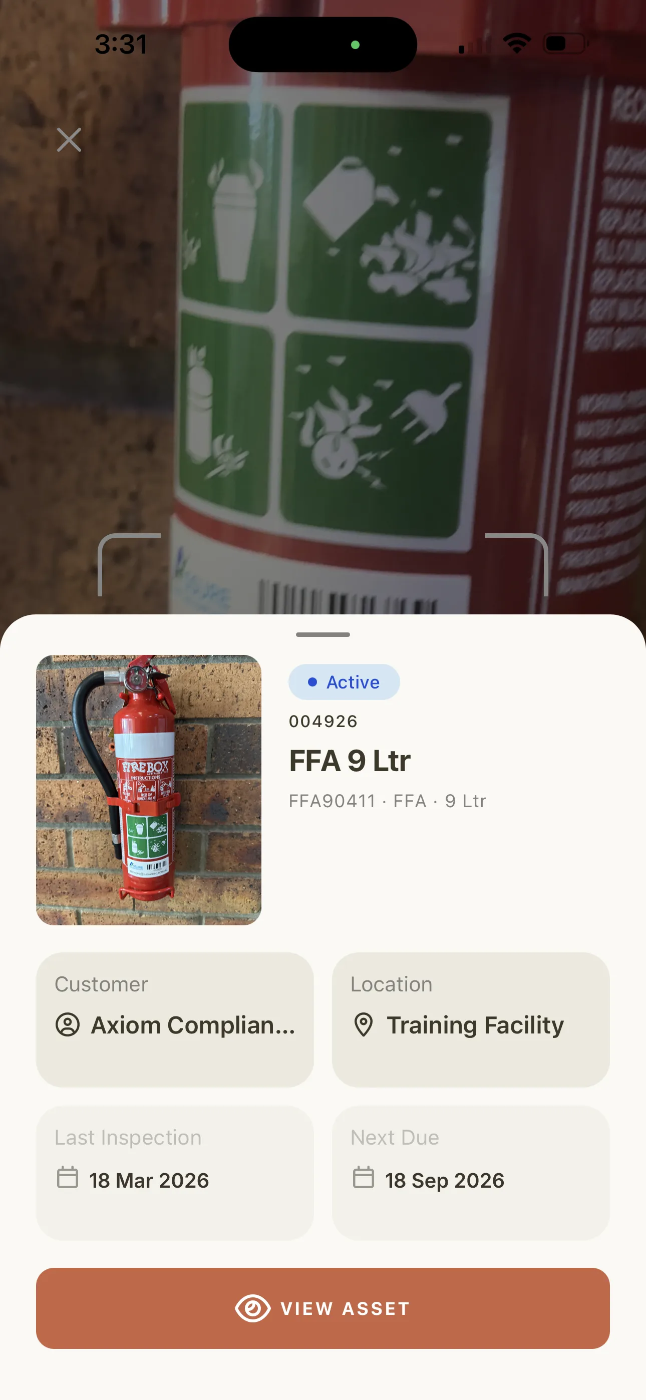 Scanning a fire extinguisher barcode with the Maintenance Partners app and pulling up its full asset record